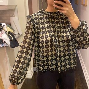 Aritzia black ruffle printed blouse. Size xs.